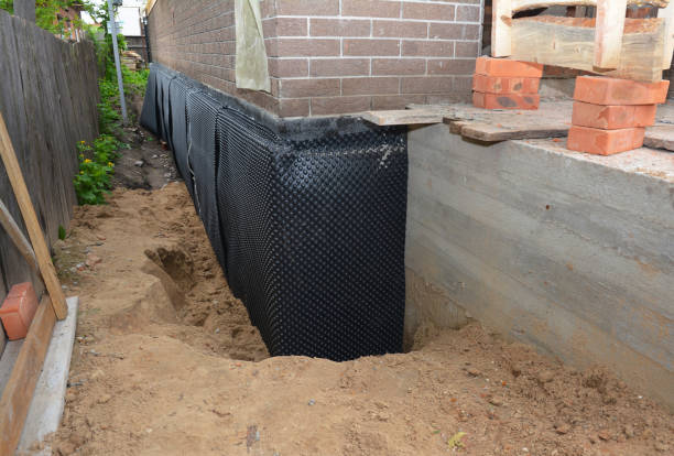 Happy homeowners after waterproofing job in Crab Orchard